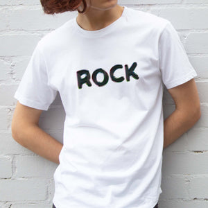 I'm With The Band® Bubble Rock T-shirt with iridescent bubble slick black print on white T being worn by a faceless man standing against a white painted brick wall